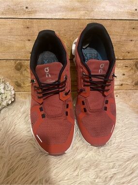 On Cloud 5 Swiss Engineering Sneaker in a rust red color